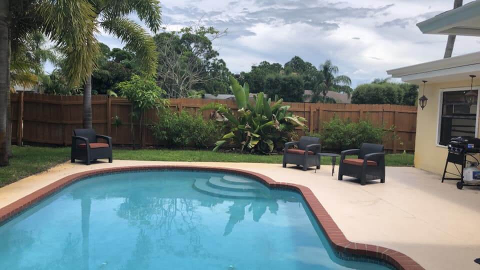 The in ground pool at Cayuga Sober Living House in Port St Lucie, Florida