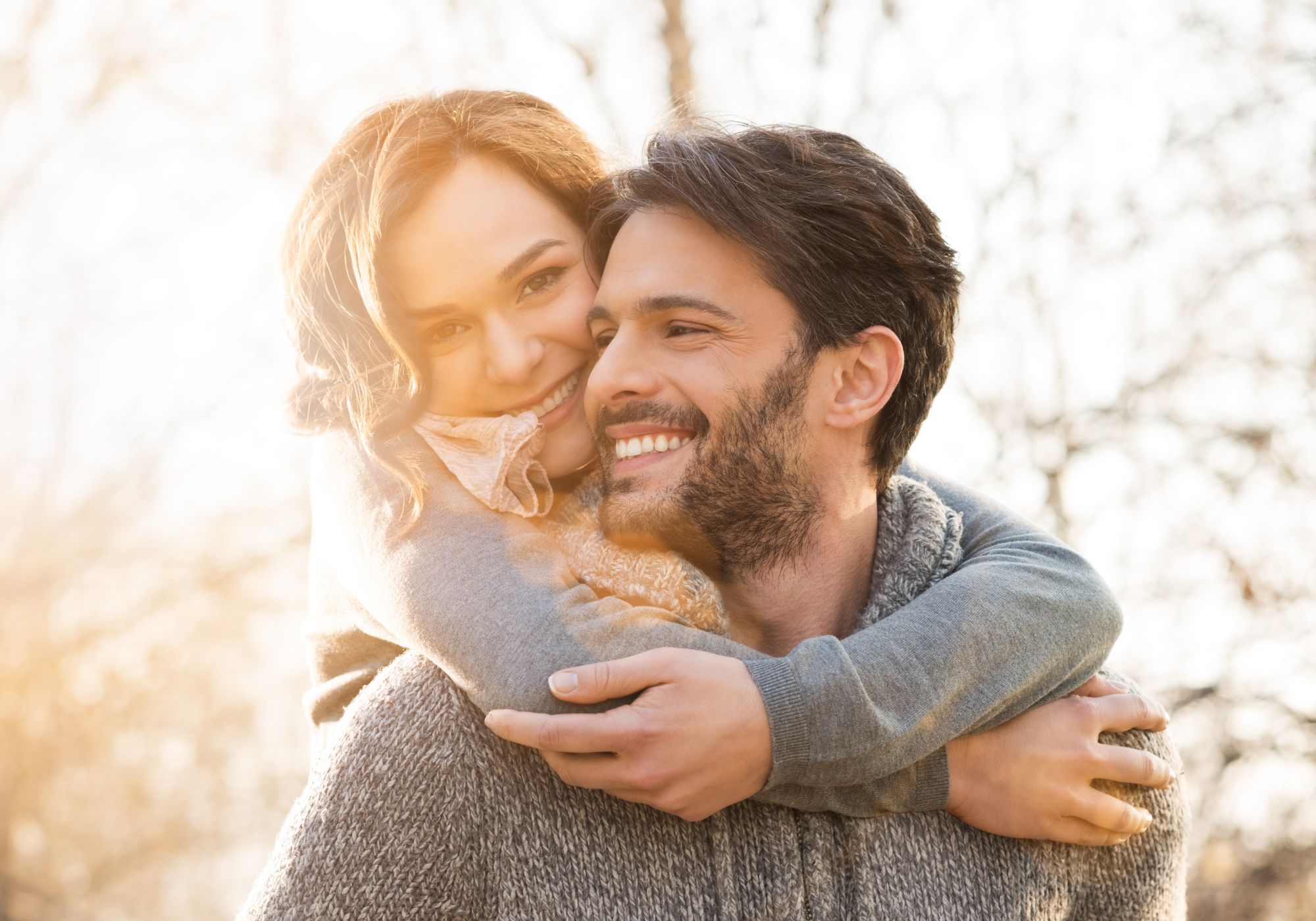 A happy couple hugging after addiction treatment