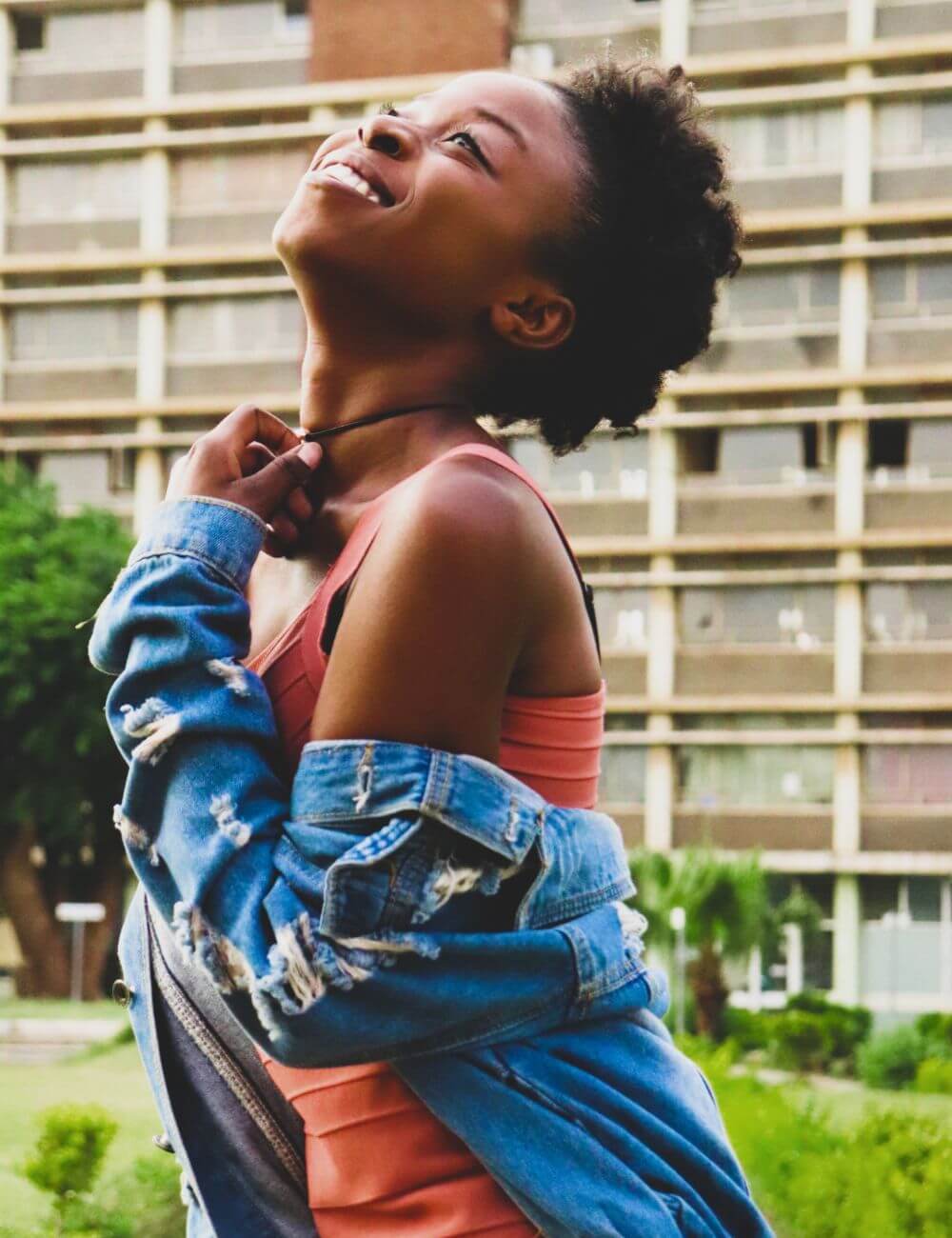 A woman in sober living looking up with a smile on her face